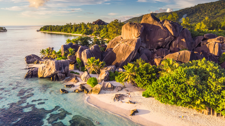 drone shot of Anse Source d'Argent beach in Seychelles at sunset.