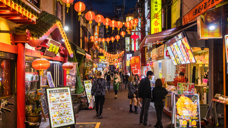 nighttime street with lanterns and restaurants