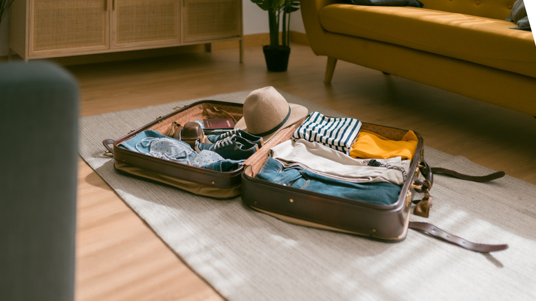 Packed suitcase open on the floor