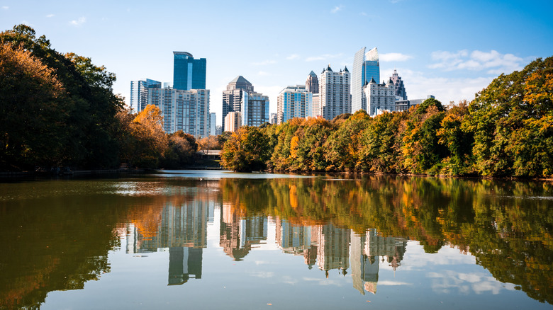 Atlanta skyline and fall foliage reflected in a body of water