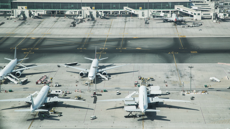 An aerial view of airplanes parked at an airport.