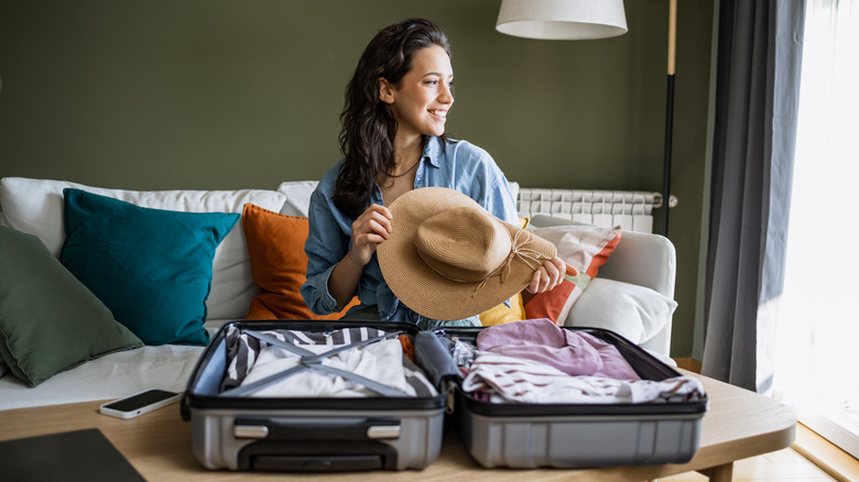 Woman packing a suitcase