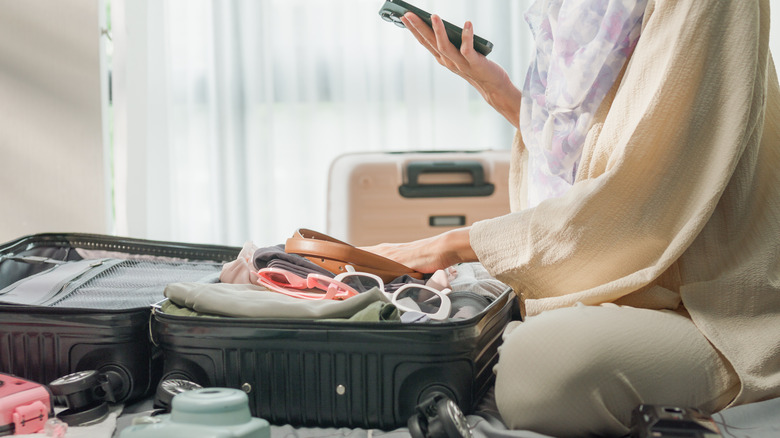 Woman Packing Suitcase