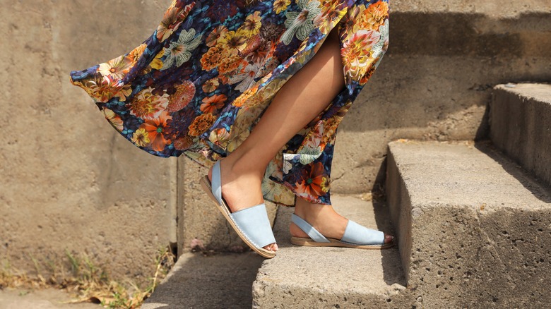 woman on stairs wearing sandals