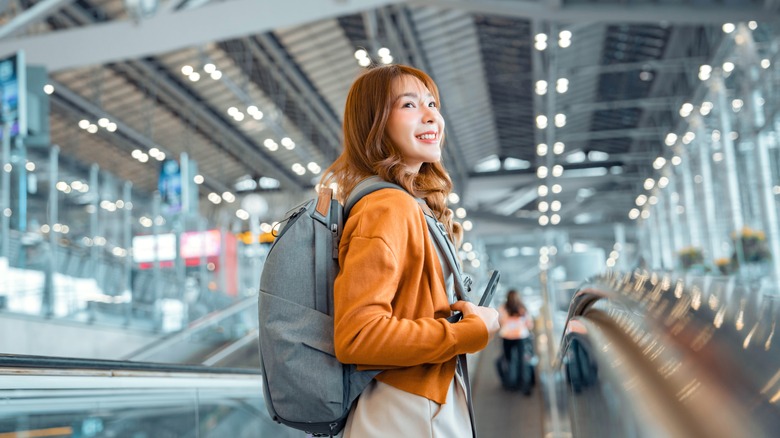smiling traveler at airport