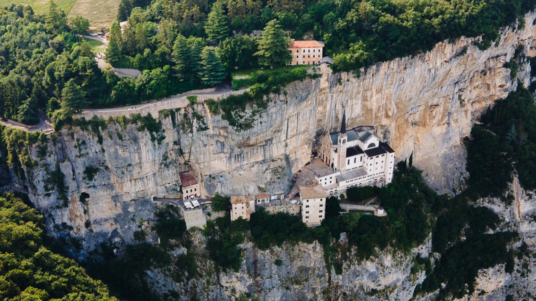 Aerial view of Santuario Madonna Della Corona church on a cliff