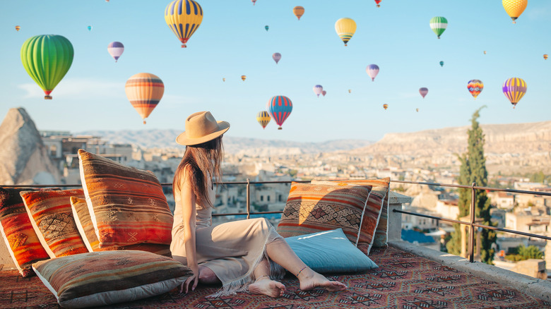 Traveler looking at balloons in Cappadocia