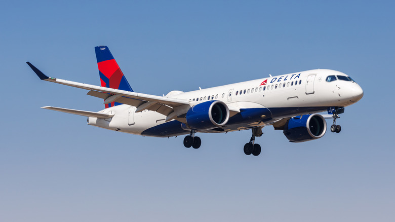 A Delta Airbus A220-300 plane in flight.