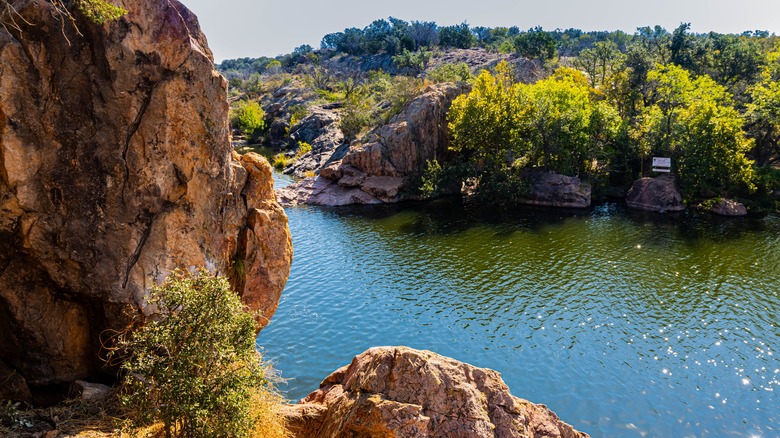 Large rock in front of lake view