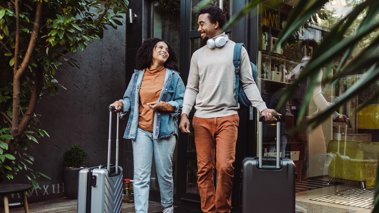 Couple at hotel with luggage