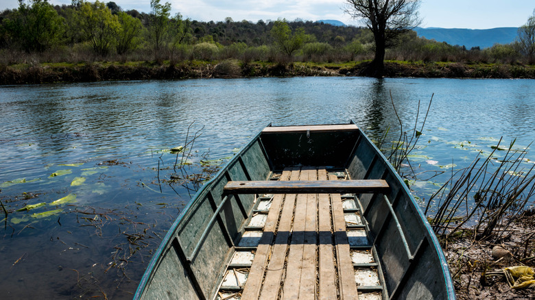 A kayak sits on the shore of Hutovo Blato Nature Park