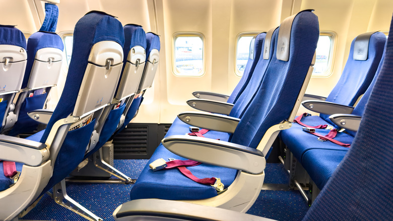 Empty airplane cabin interior passenger seats