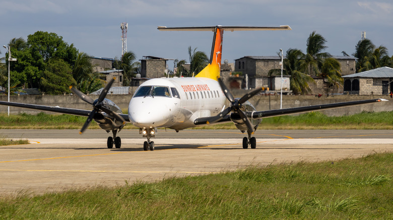 A Sunrise Airways plane on a runway.