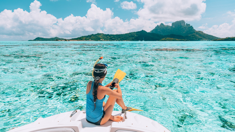 Snorkeler sitting on a boat