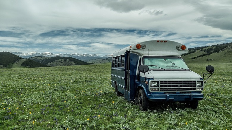 skoolie parked on grass in Wyoming