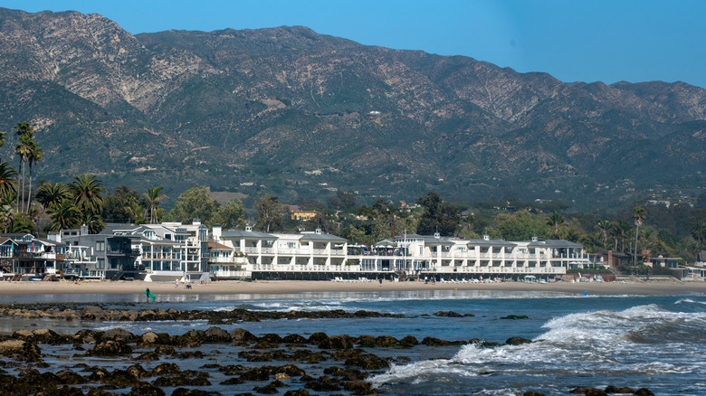 The Rosewood Miramar Resort from across the water with mountains in the background