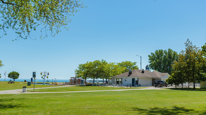 A large green space by the lake