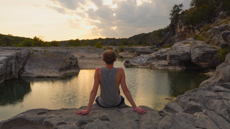 Young man enjoying view at Pedernales Falls State Park, Texas