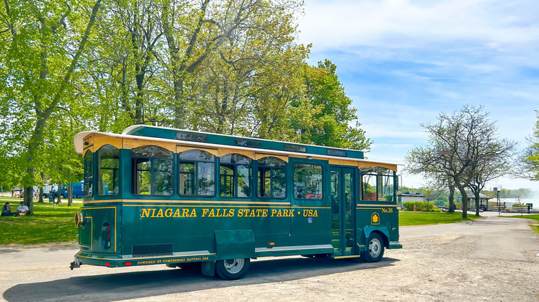 The Niagara Falls Scenic Trolley parked in a lot on a spring's day.