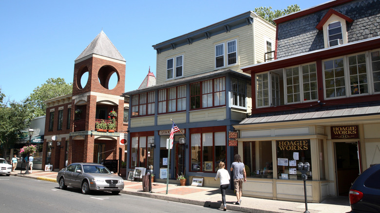 Pedestrians step onto a sidewalk in downtown Doylestown, Pennsylvania