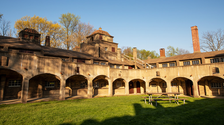 The Moravian Pottery and Tile Works Museum stands beneath a blue sky in Doylestown, Pennsylvania