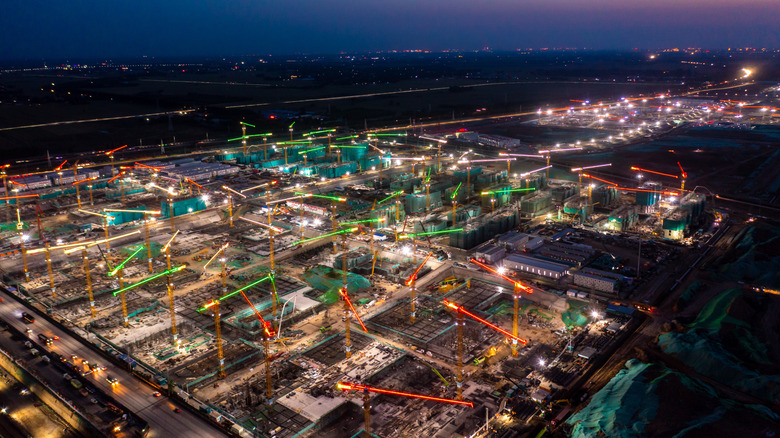 Aerial view of a city in construction at sunrise