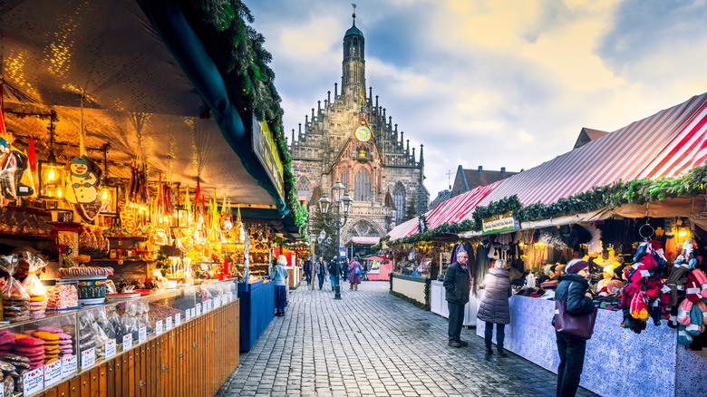 People walking in an outdoor European Christmas market