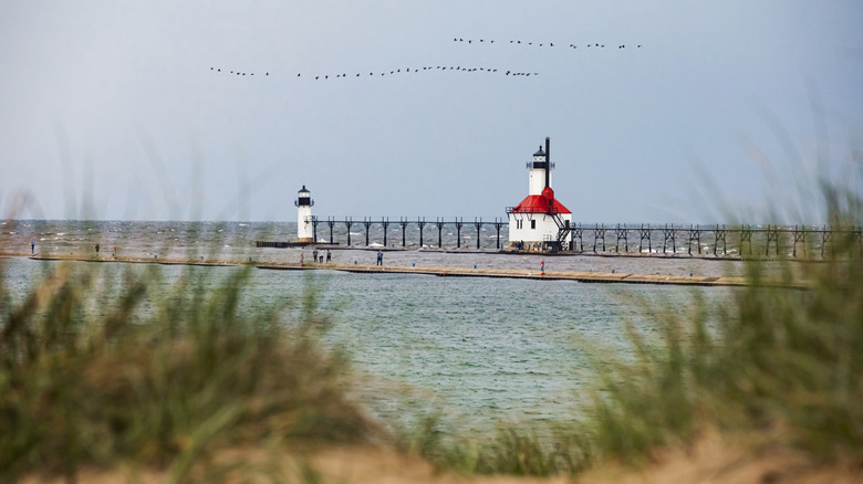 Two Lake Michigan lighthouses on a pier