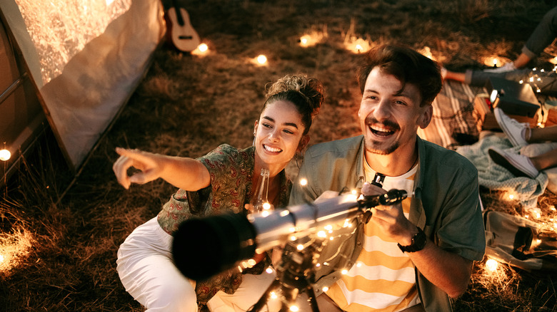 A couple stargazing together at a star party