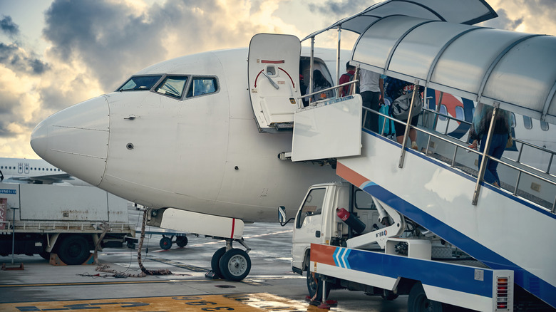 Passengers boarding an airplane at Yantai Penglai International Airport