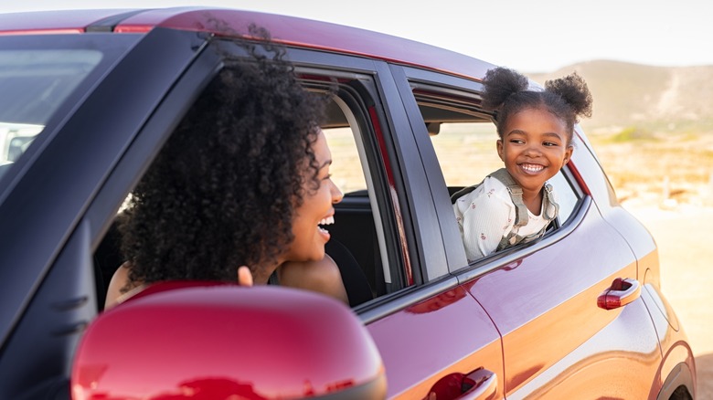 Woman and daughter in car