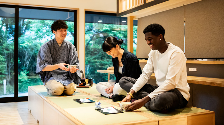 Tourists doing tea ceremony in Japan