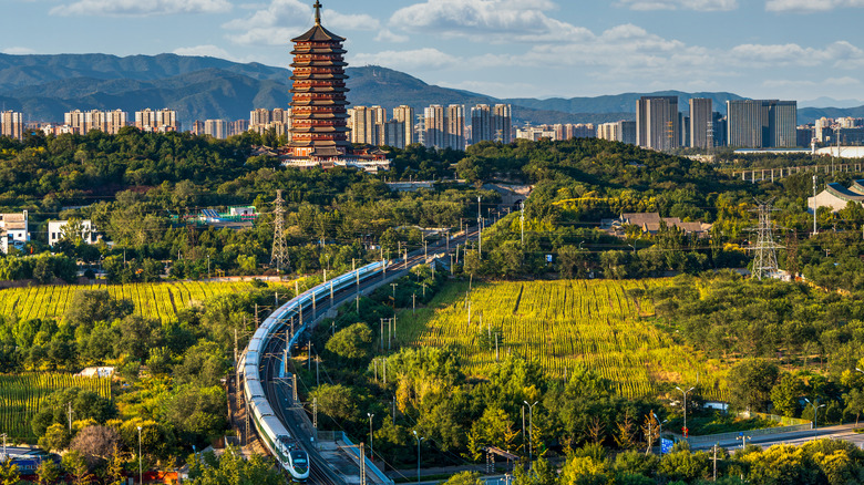 High-speed rail passes under the Yongding Tower in Beijing, China