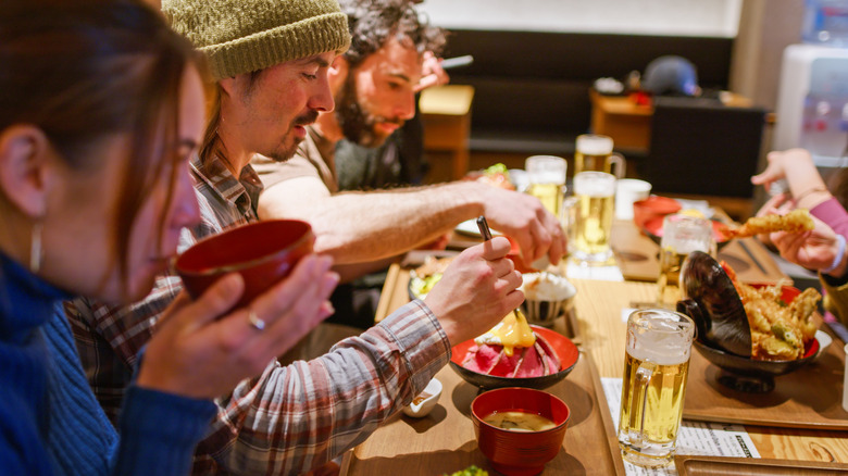 Diners eating at an Asian restaurant