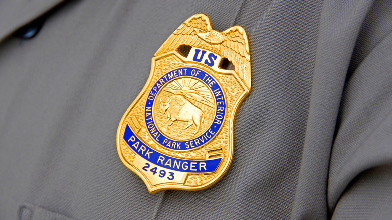 Closeup on a national park ranger badge.