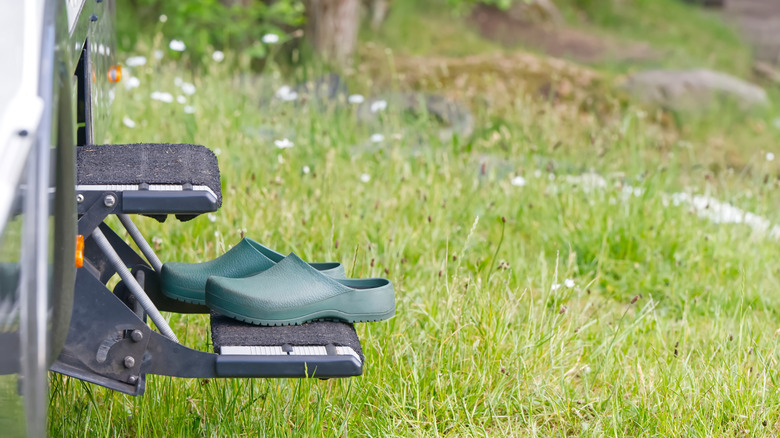 slip on garden shoes on steps of RV