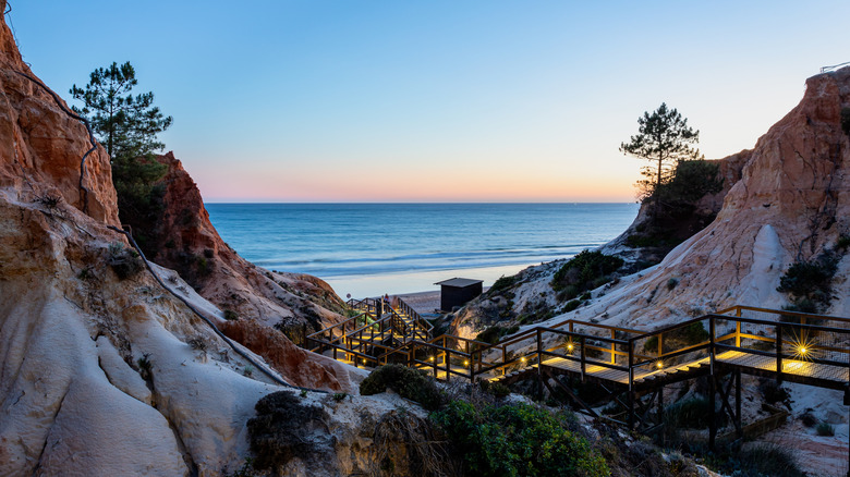 wood steps leading down to a beautiful beach