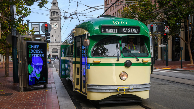 Bus-like streetcar wires clocktower Ferry Building