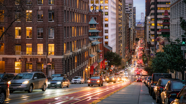 Headlights cars tracks San Francisco street