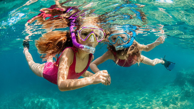 Two young girls snorkeling