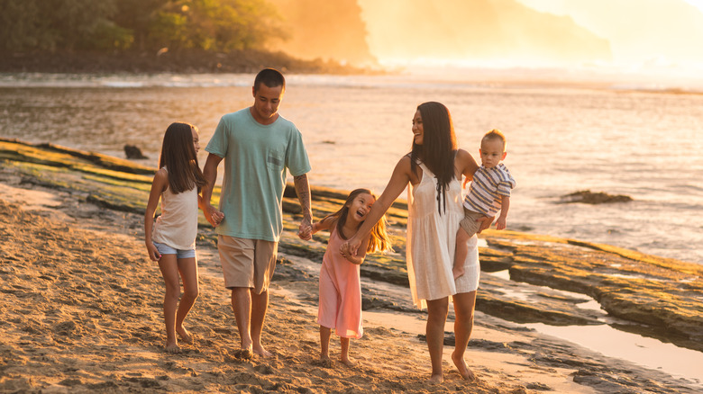 family walking by hawaii lake