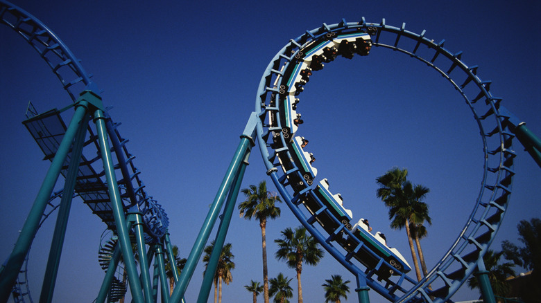 MonteZOOMa's Revenge rollercoaster loops against a blue sky