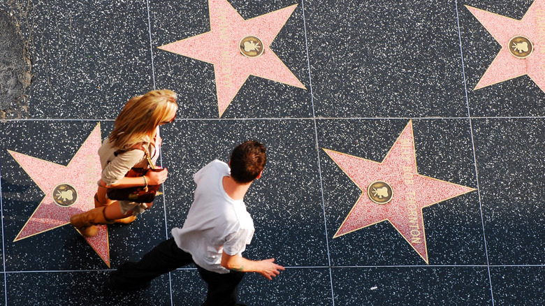 Overhead shot of couple near Hollywood Walk of Fame stars
