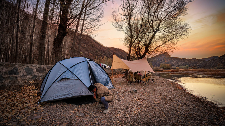 Camp by the river in the evening