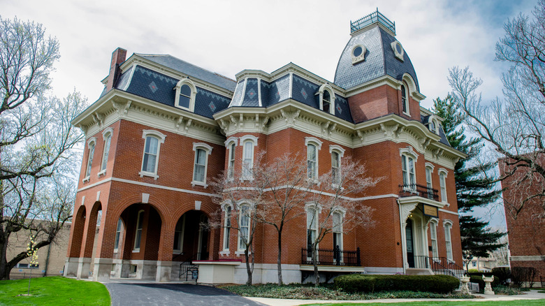 Brick historic house with black roof