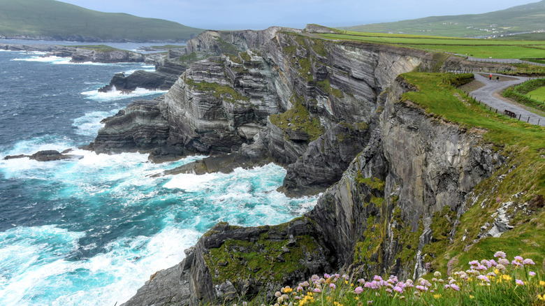 Waves crash against the Kerry cliffs