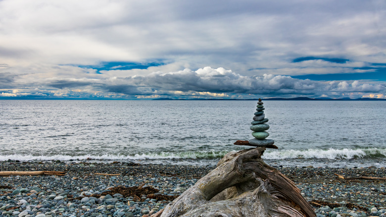 Cairn on beach by Pacific Ocean
