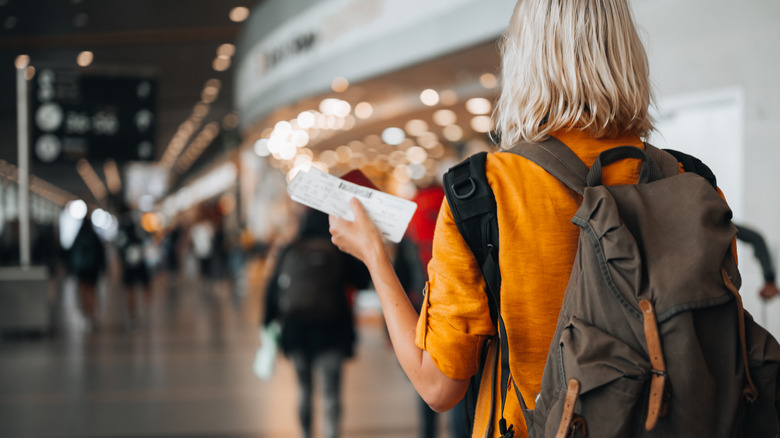 passenger walking through airport