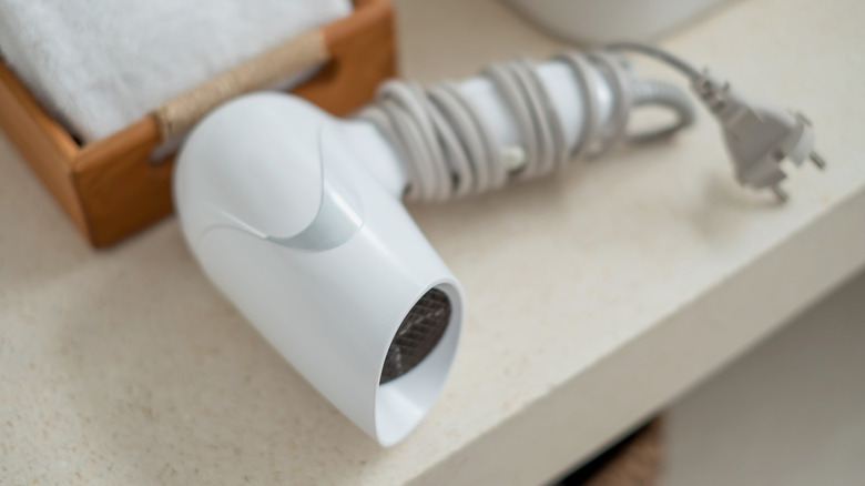A hair dryer in a hotel room