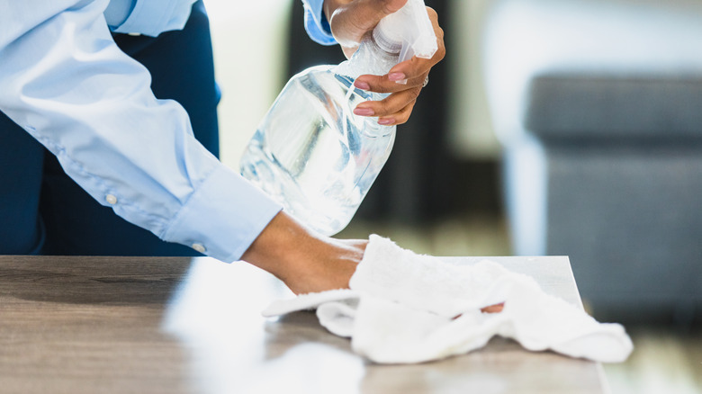 A woman cleaning a hotel room